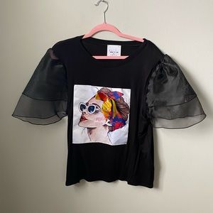 Black Top w/ puffy sleeves and picture of a lady